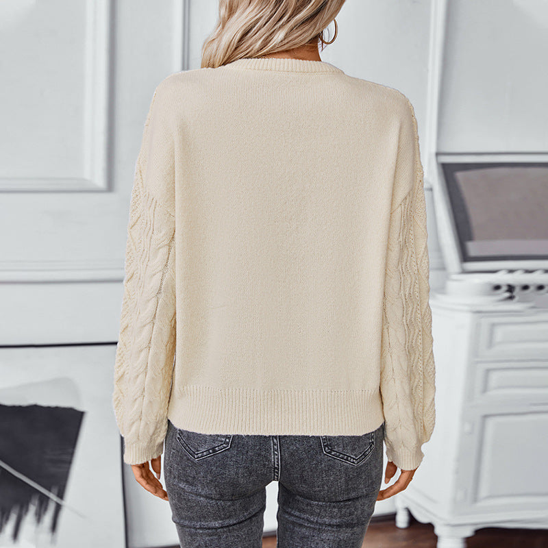 Kabelstrikket langærmet sweater til damer