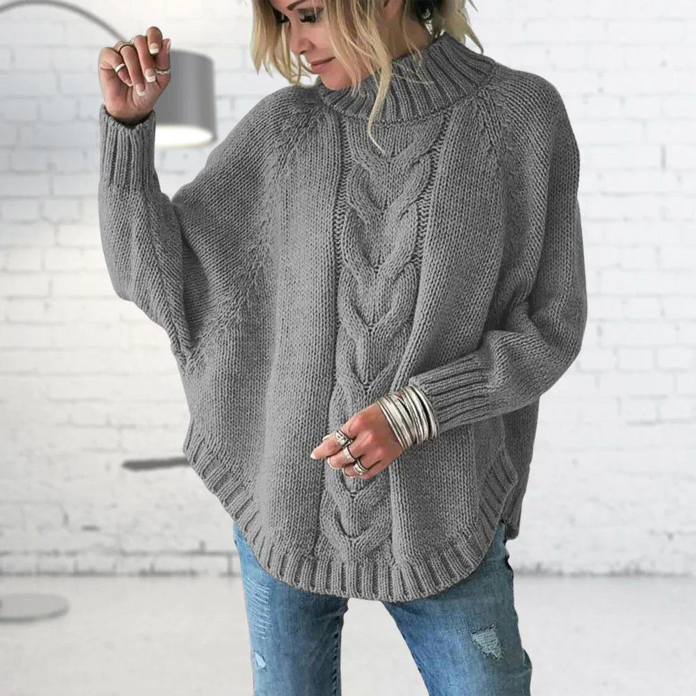 Kabelstrikket rullekravesweater med flagermusærmer til damer