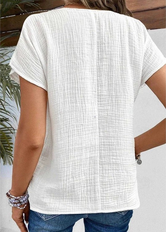 Struktureret damebluse med knapper
