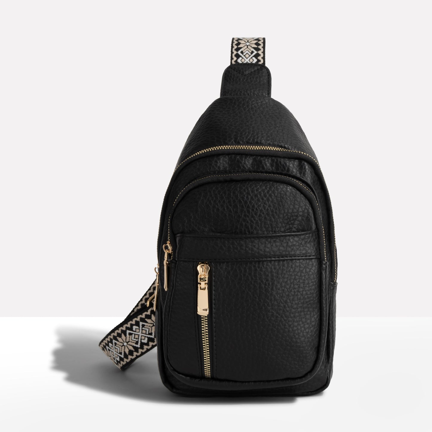 Crossbody-slingtaske til damer med mønstret rem