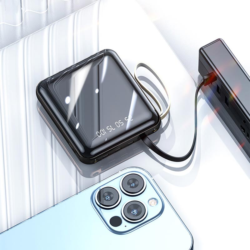 Hurtigopladende 20.000 mAh mini powerbank med integrerede kabler