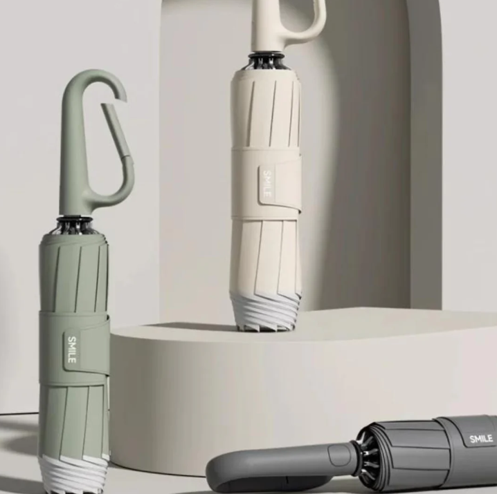 Kompakt stormparaply med reflekterende kant for sikkerhed og komfort
