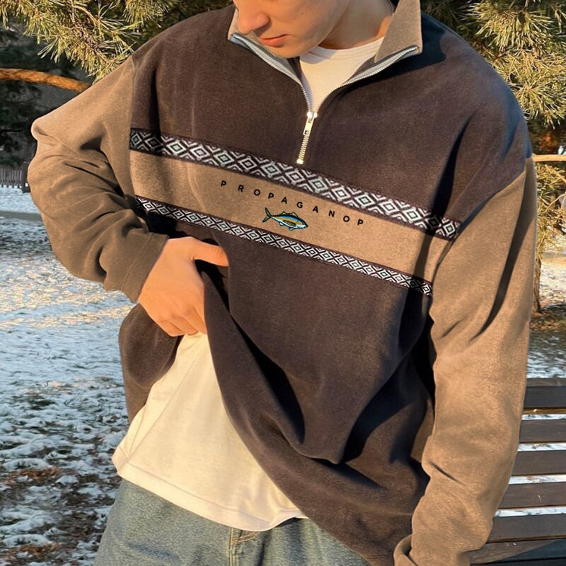 Moderne pullover med høj krave og halv lynlås