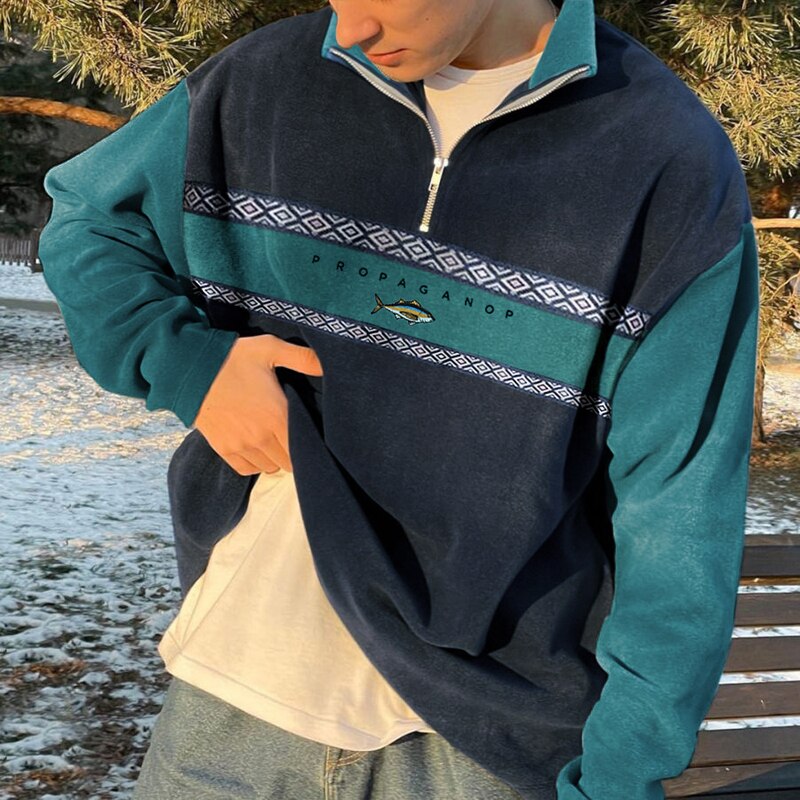 Moderne pullover med høj krave og halv lynlås