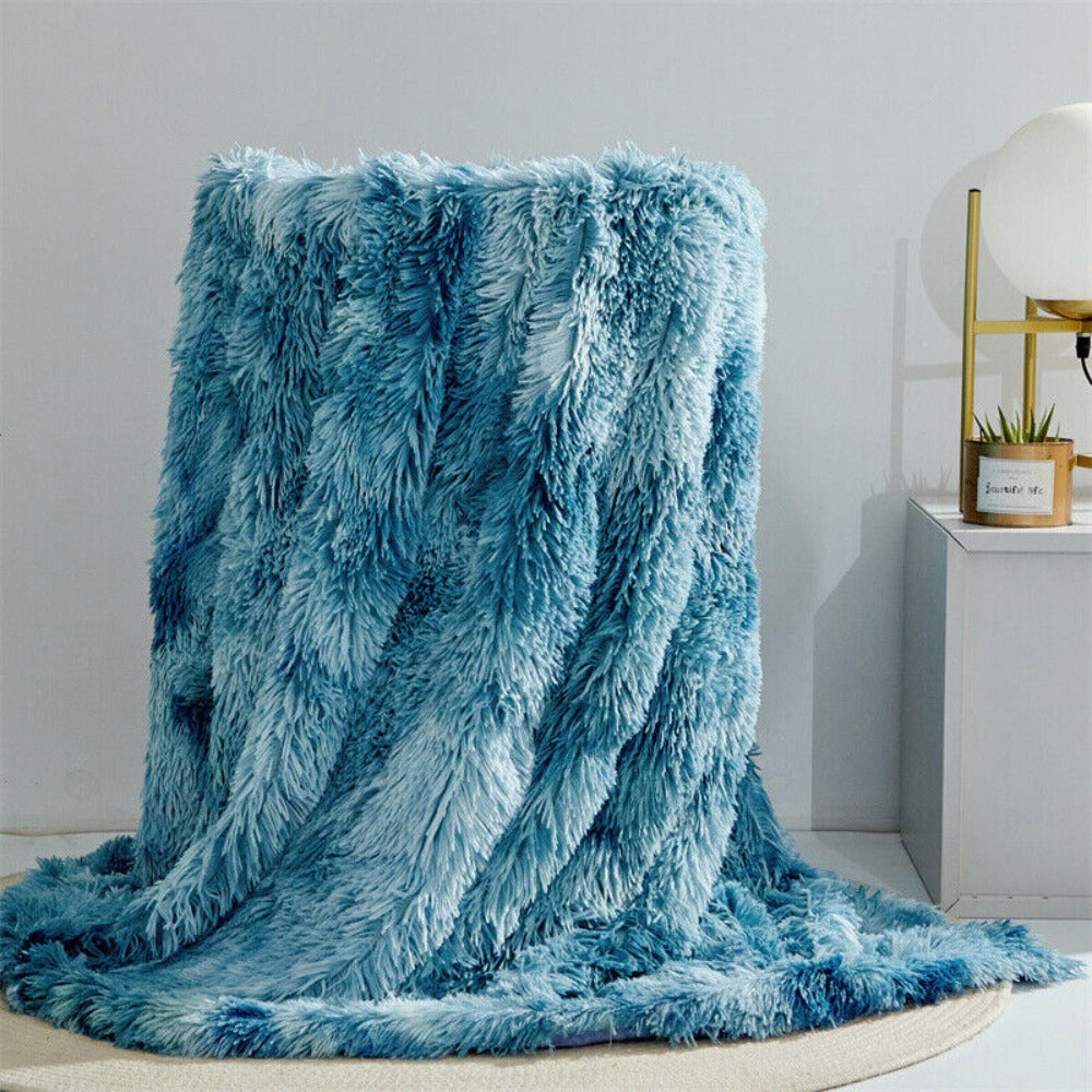 Plysset plaid i kunstpels