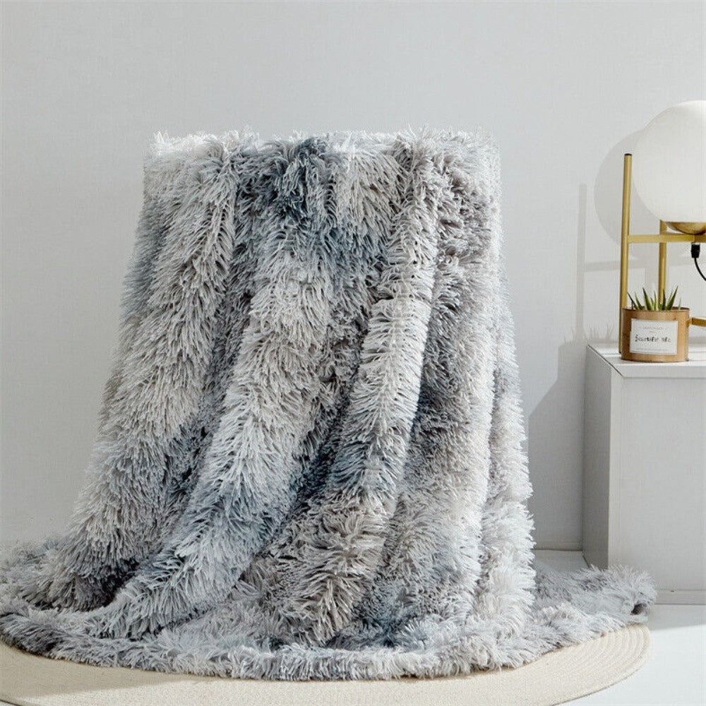 Plysset plaid i kunstpels