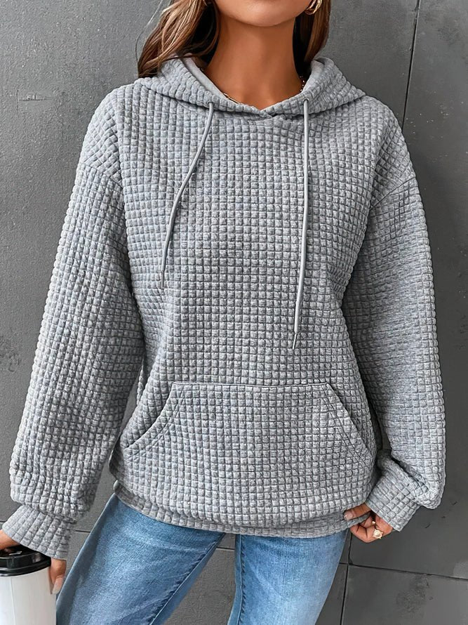 Stilfuld quiltet hættetrøje