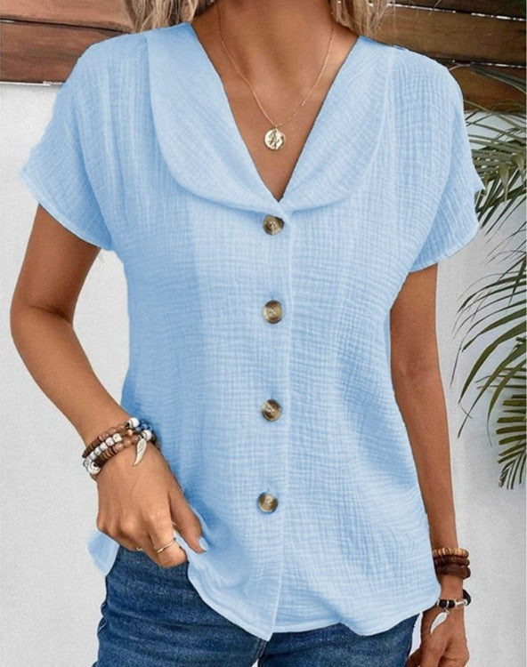 Struktureret damebluse med knapper