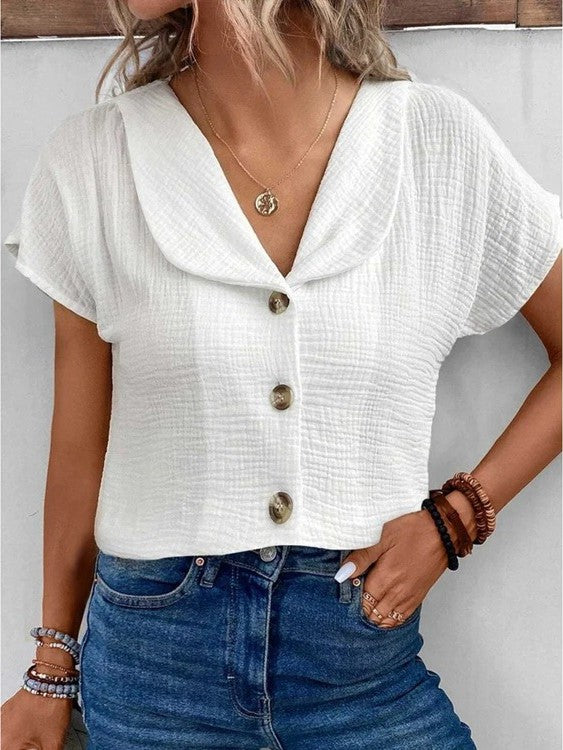 Struktureret damebluse med knapper