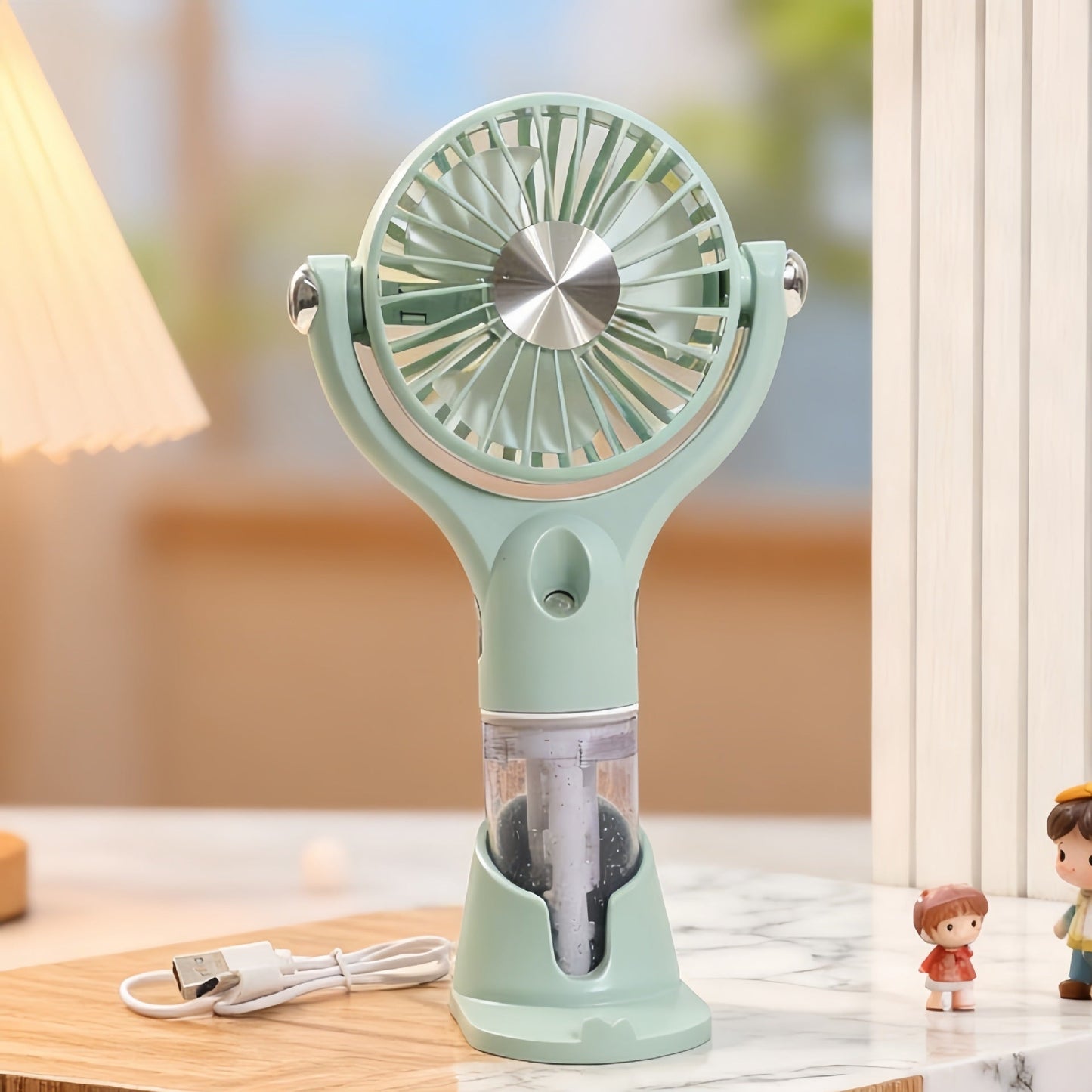 Unisex bærbar håndventilator med spray, USB-opladning og ergonomisk design