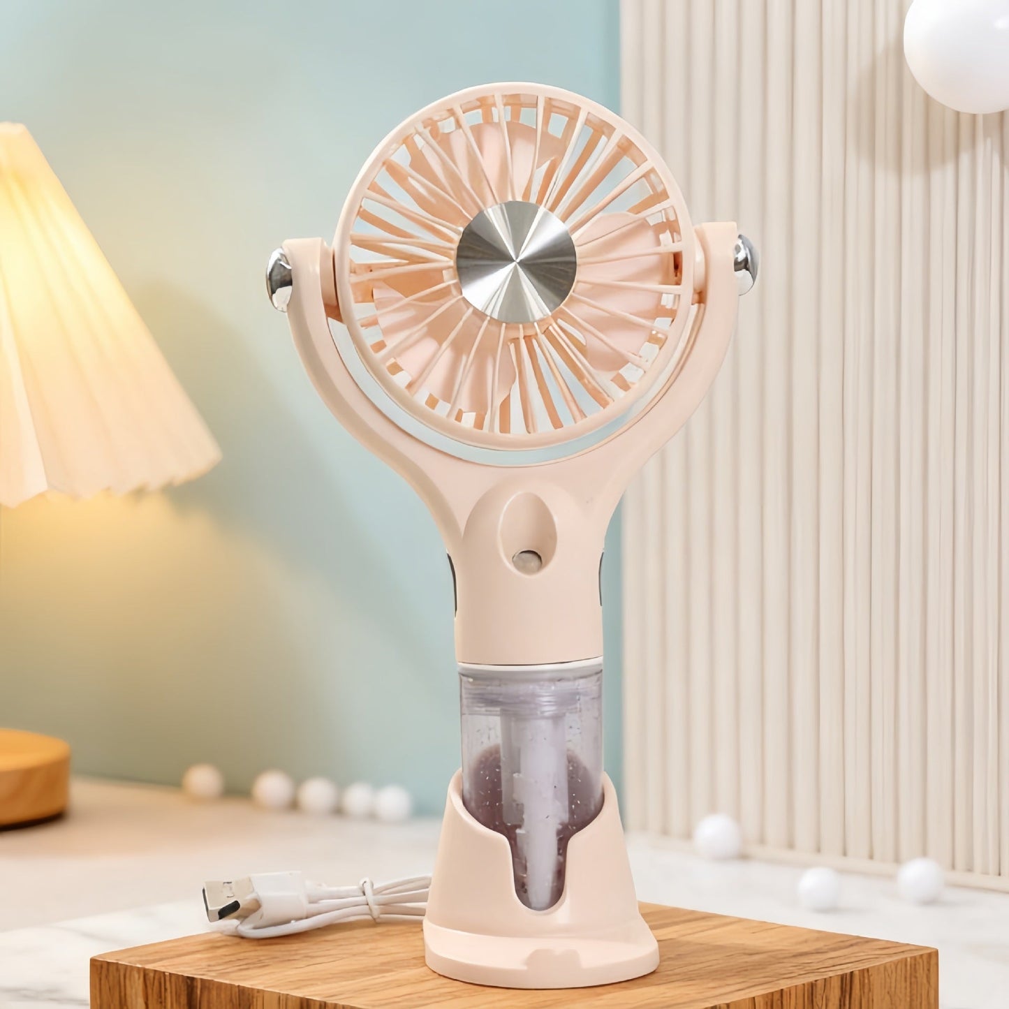 Unisex bærbar håndventilator med spray, USB-opladning og ergonomisk design