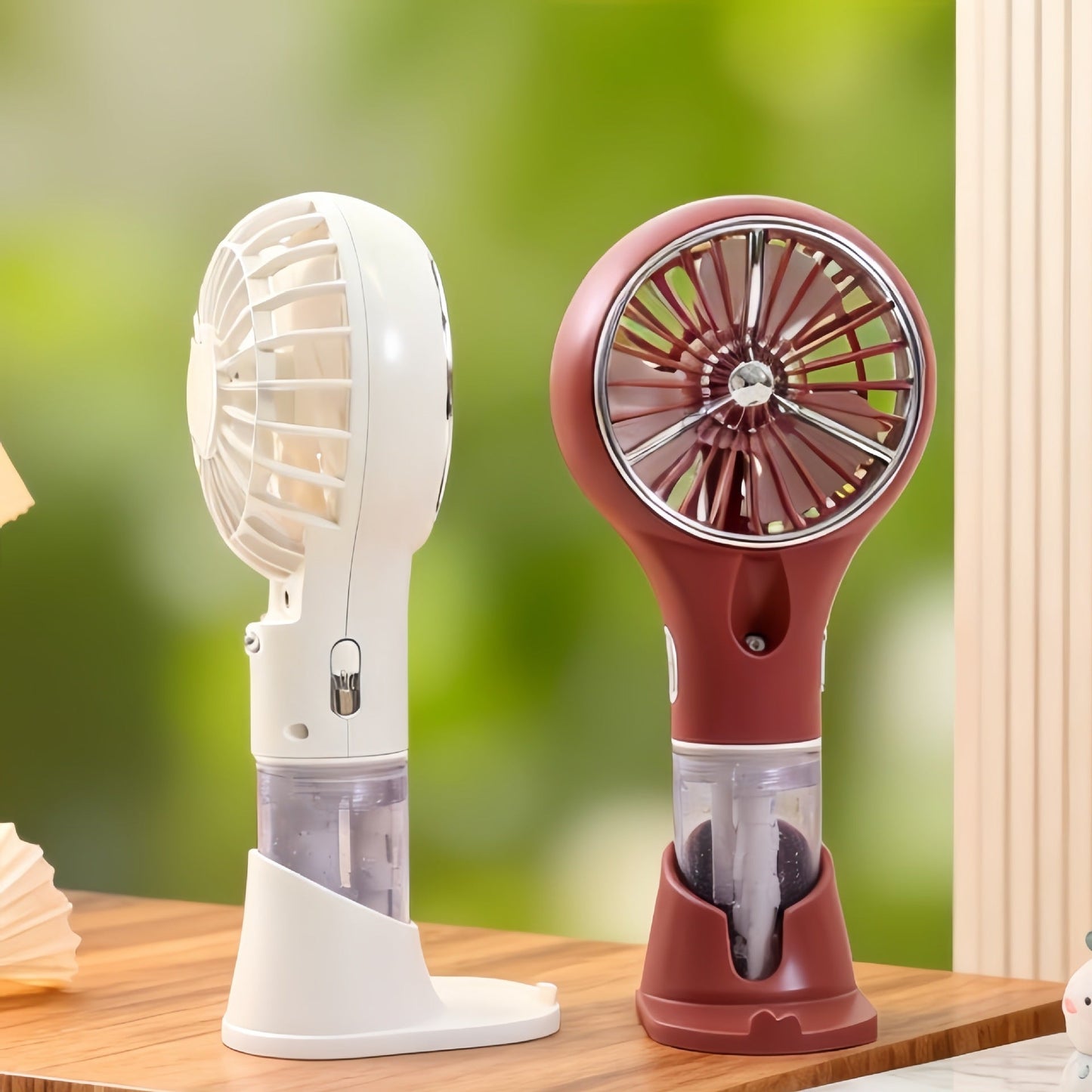 Unisex bærbar håndventilator med spray, USB-opladning og ergonomisk design